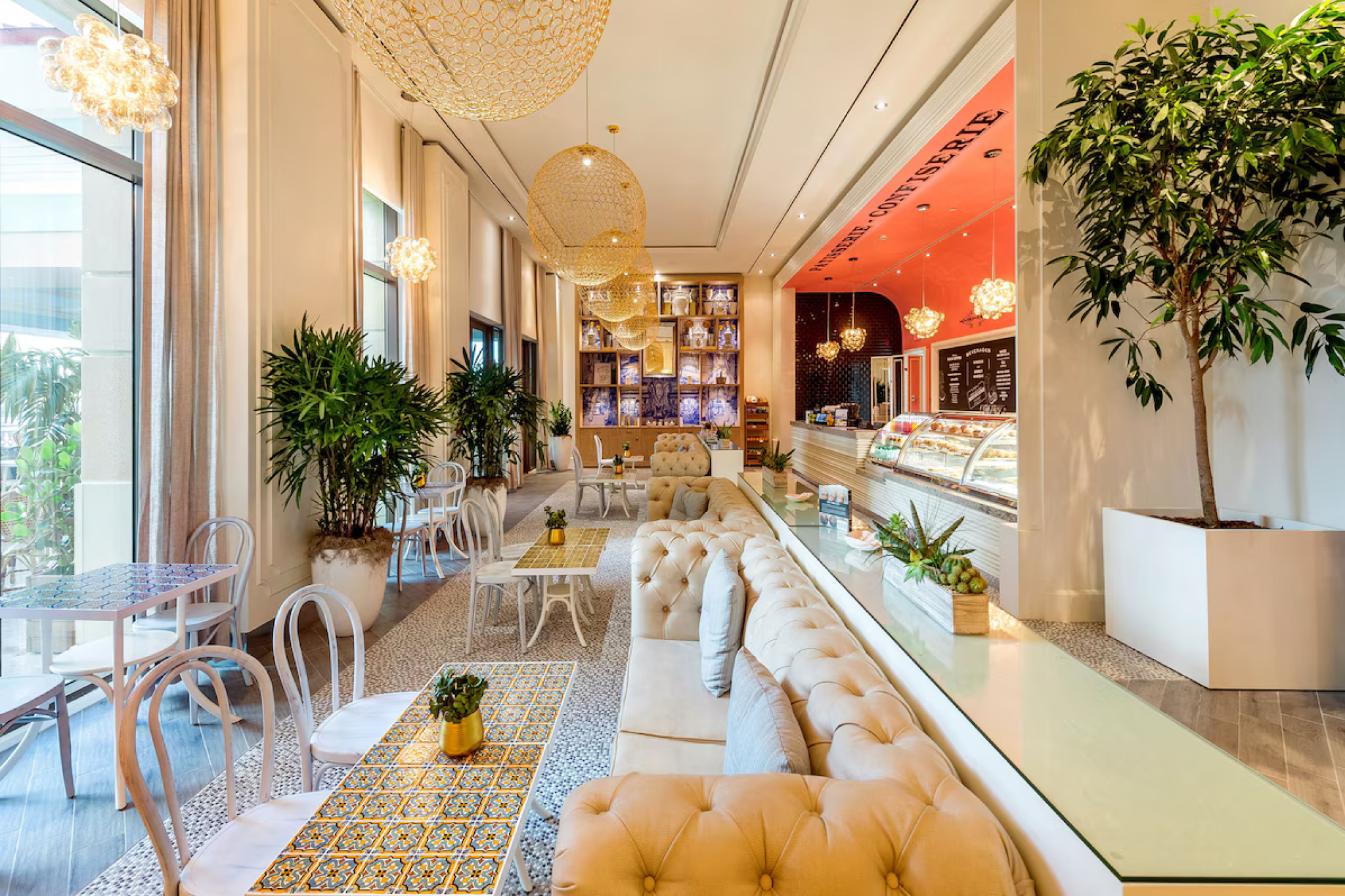 Bright café and lounge inside Grand Hyatt Baha Mar with colorful tiled tables and bakery counter