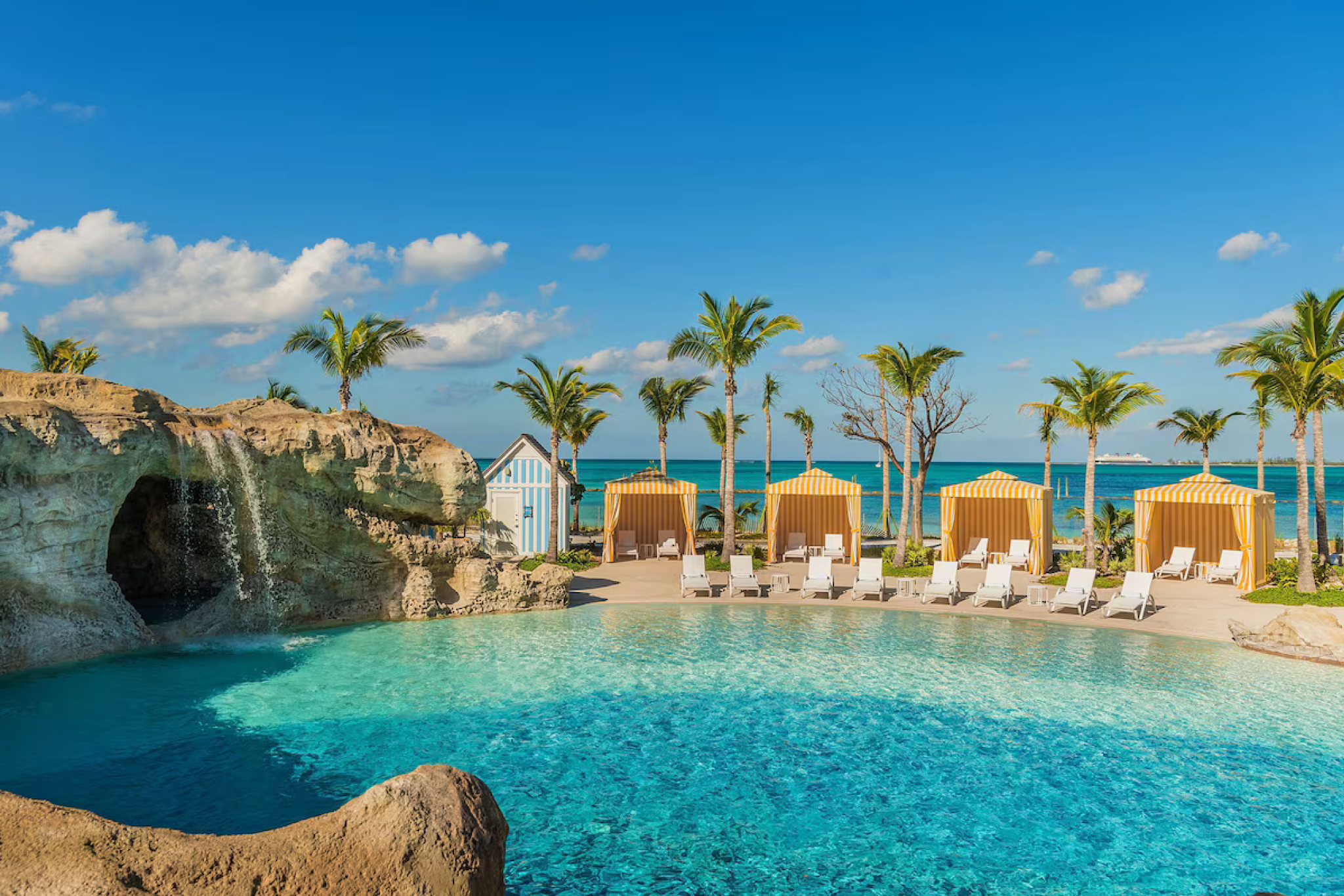 Resort pool with waterfalls, cabanas, and ocean views at Grand Hyatt Baha Mar in Nassau