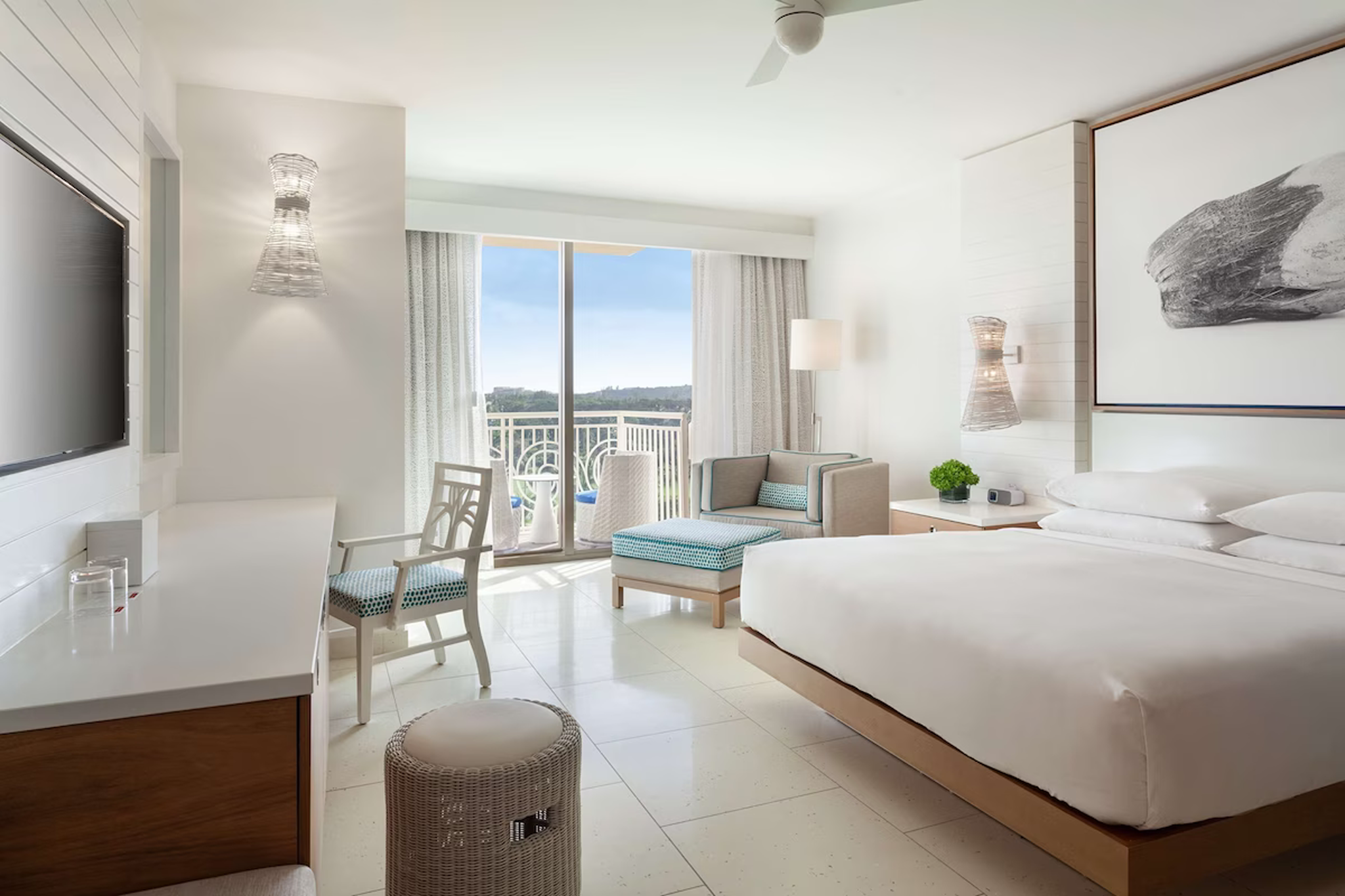 Modern guest room at Grand Hyatt Baha Mar featuring a king bed, balcony, and elegant coastal-inspired décor