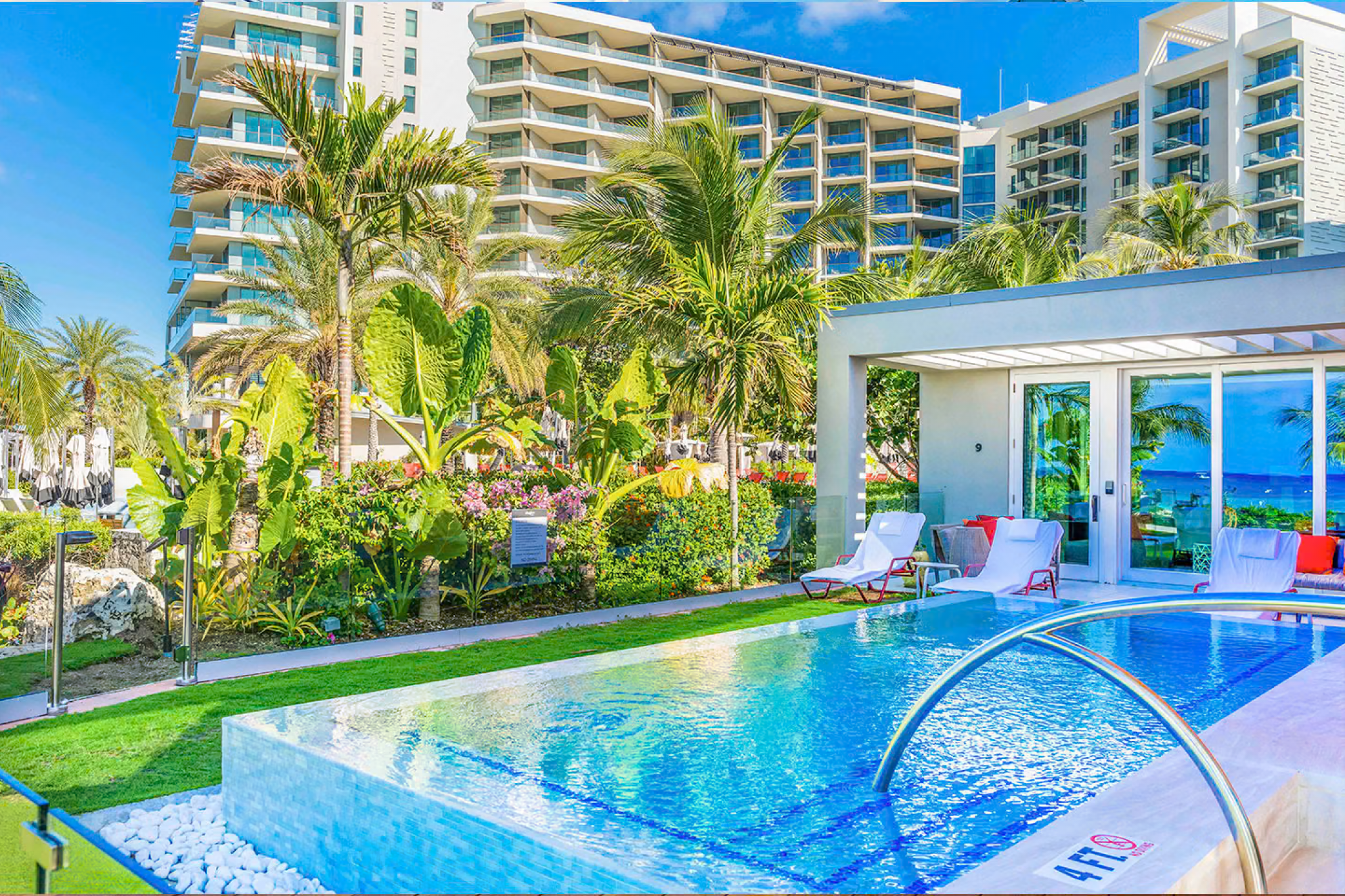 Open-air lobby at Kimpton Seafire Resort + Spa with contemporary decor, sea views, and welcoming seating areas.