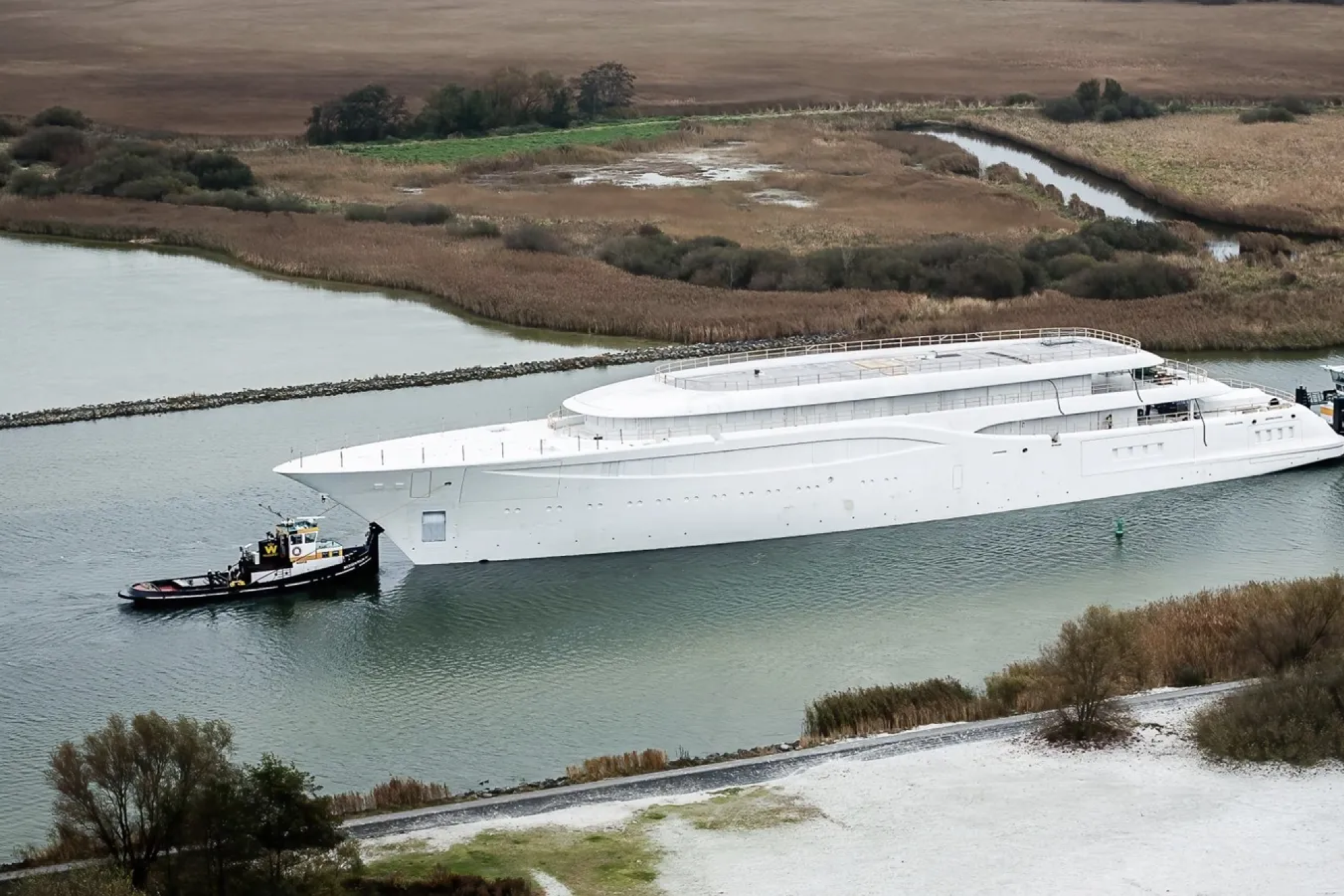 Feadship Project 1014, a 101.2-meter luxury superyacht seen during outfitting, featuring refined lines typical of major superyachts expected to launch in 2026.