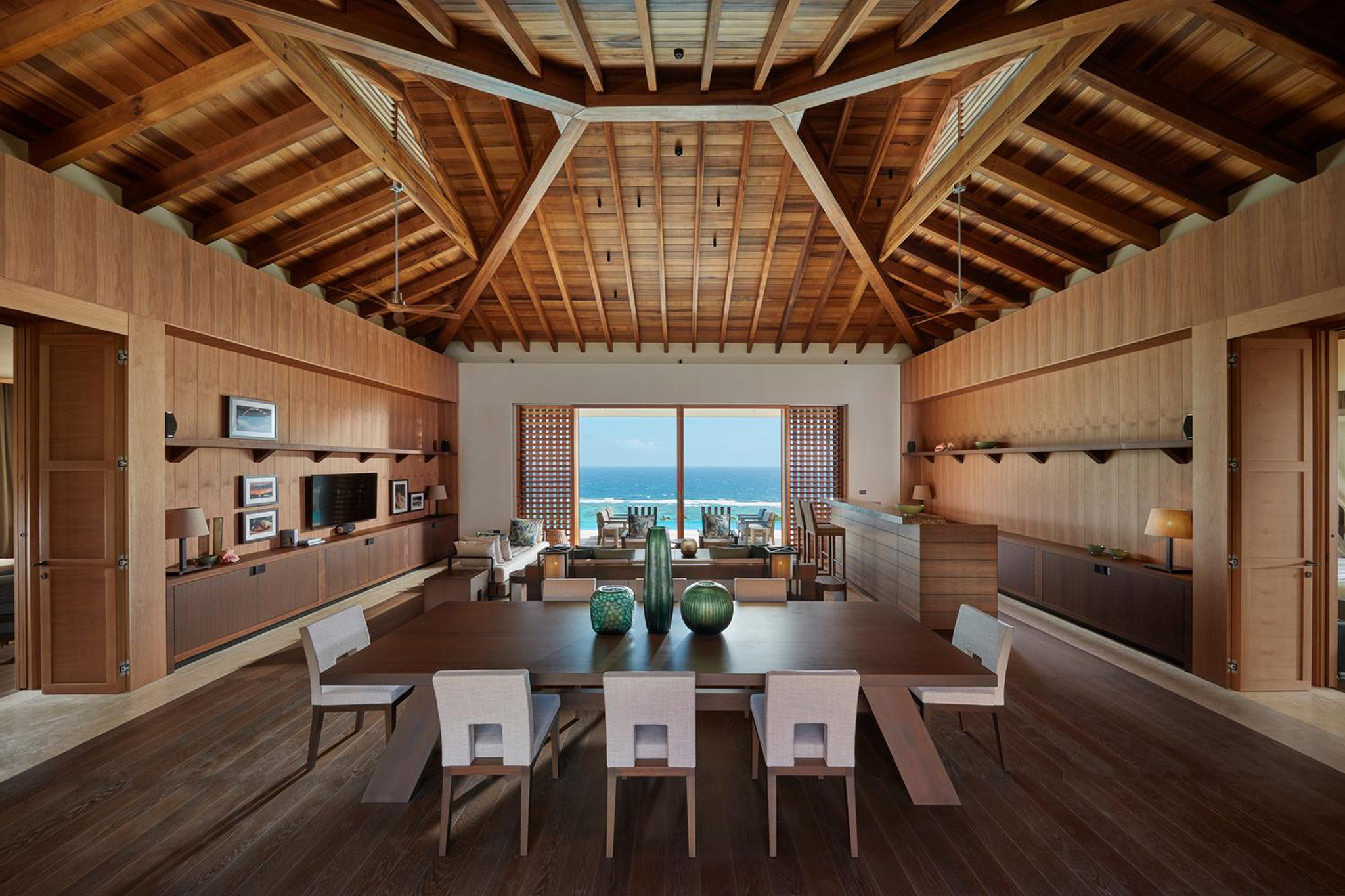 Interior shot of a luxury suite at Mandarin Oriental Canouan, subtly conveying the resort’s premium pricing through scale, materials, and views.