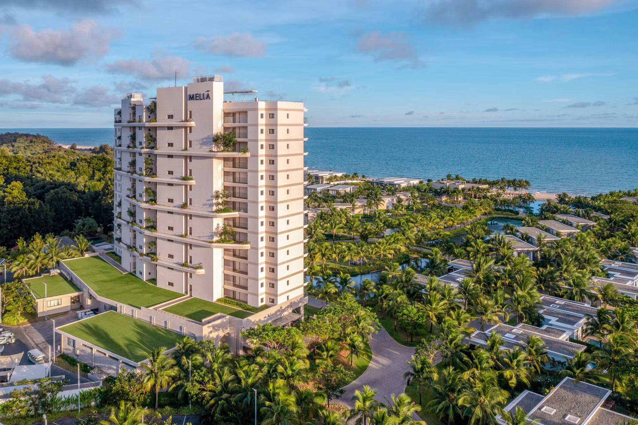 Aerial view of Melia Ho Tram Beach Resort showing its beachfront location, pools, and tropical landscaping along Vietnam’s southern coast.