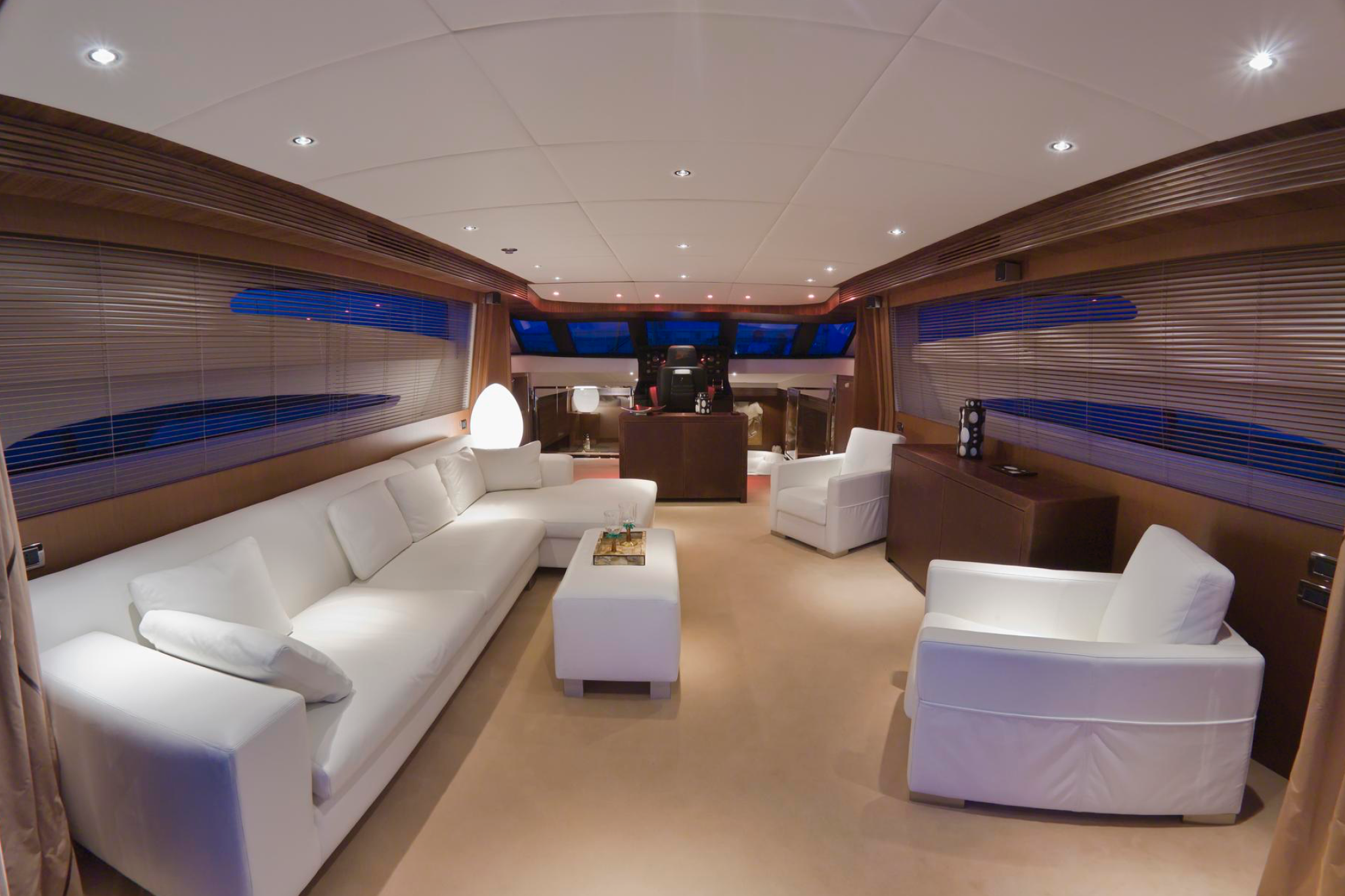 An opulent lounge area aboard a superyacht, highlighting one of the Most Fascinating Superyacht Facts about lavish interiors and comfort at sea.