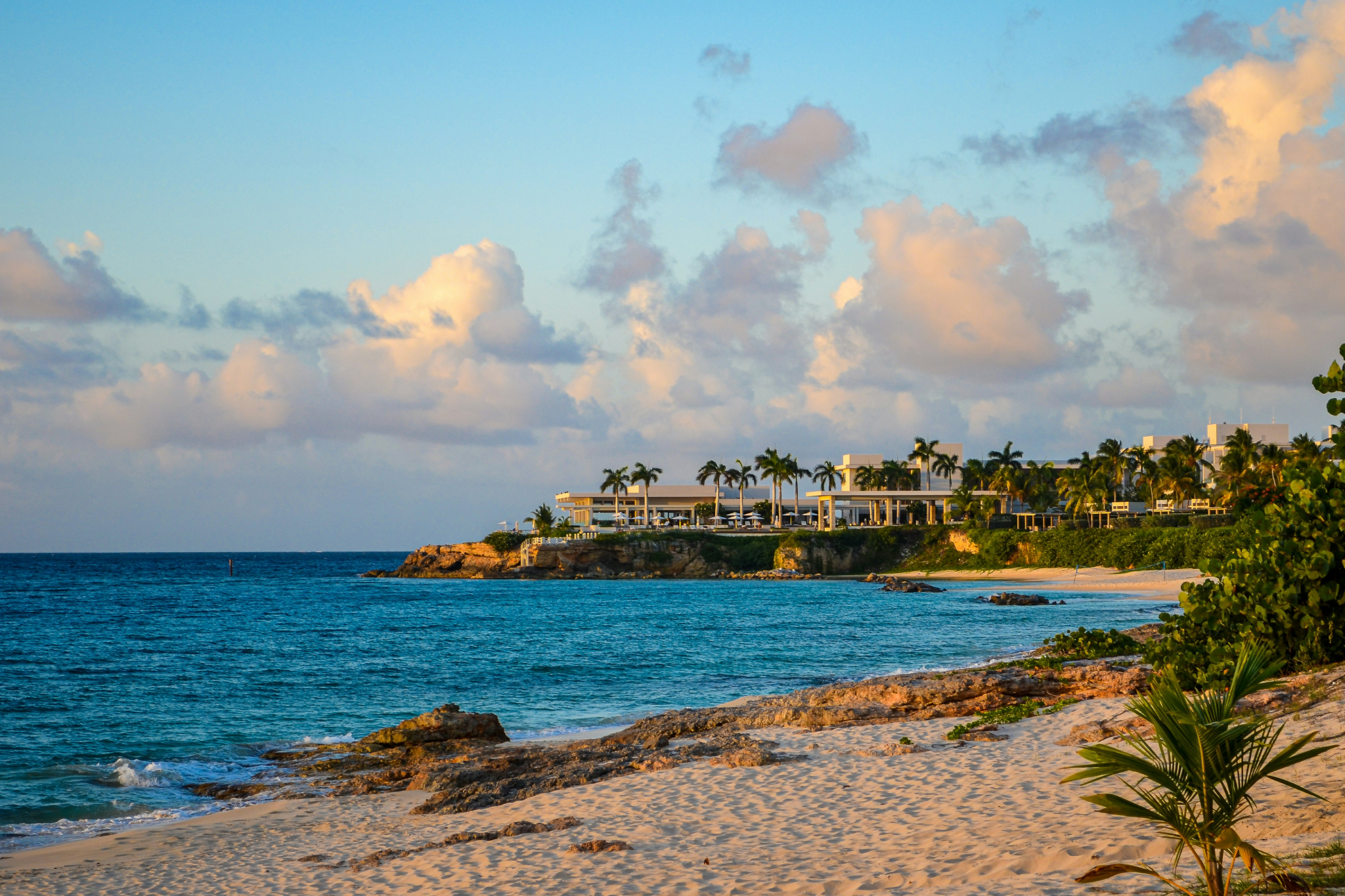 Luxury beachfront resort at sunset in Anguilla showcasing why it's among the most beautiful islands in the Caribbean