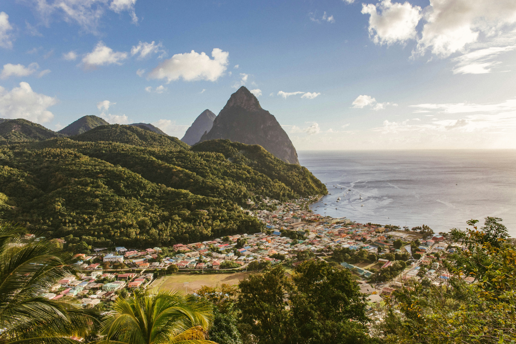Dramatic twin Pitons volcanic peaks rising from the sea in St. Lucia, among the most beautiful islands in the Caribbean
