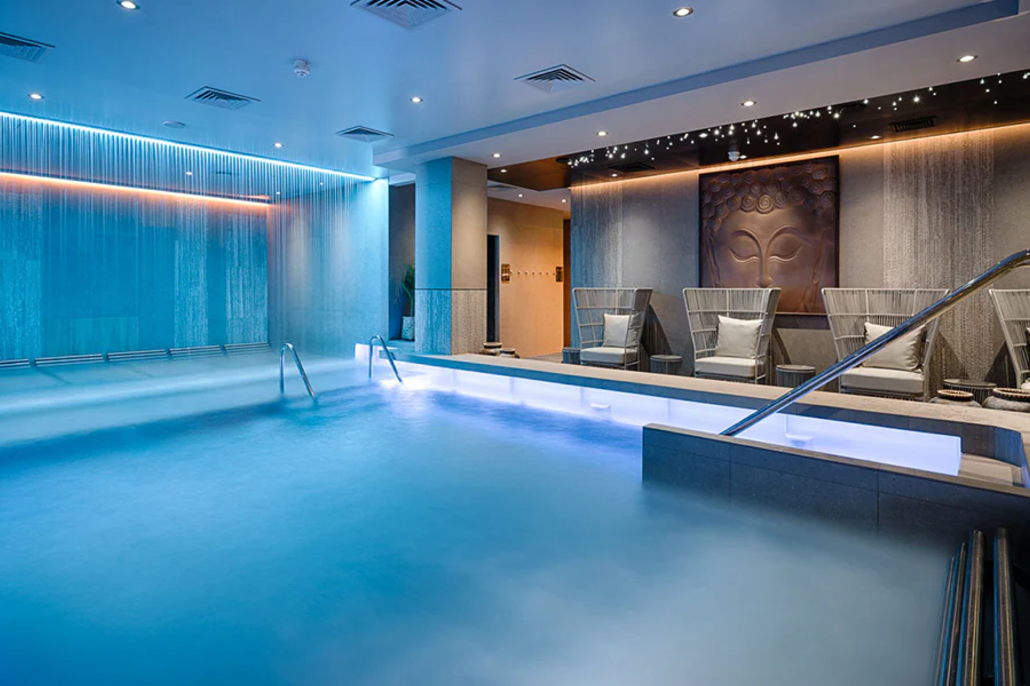 Tranquil spa retreat on MSC World America with a serene thermal pool, mood lighting, and relaxation loungers.