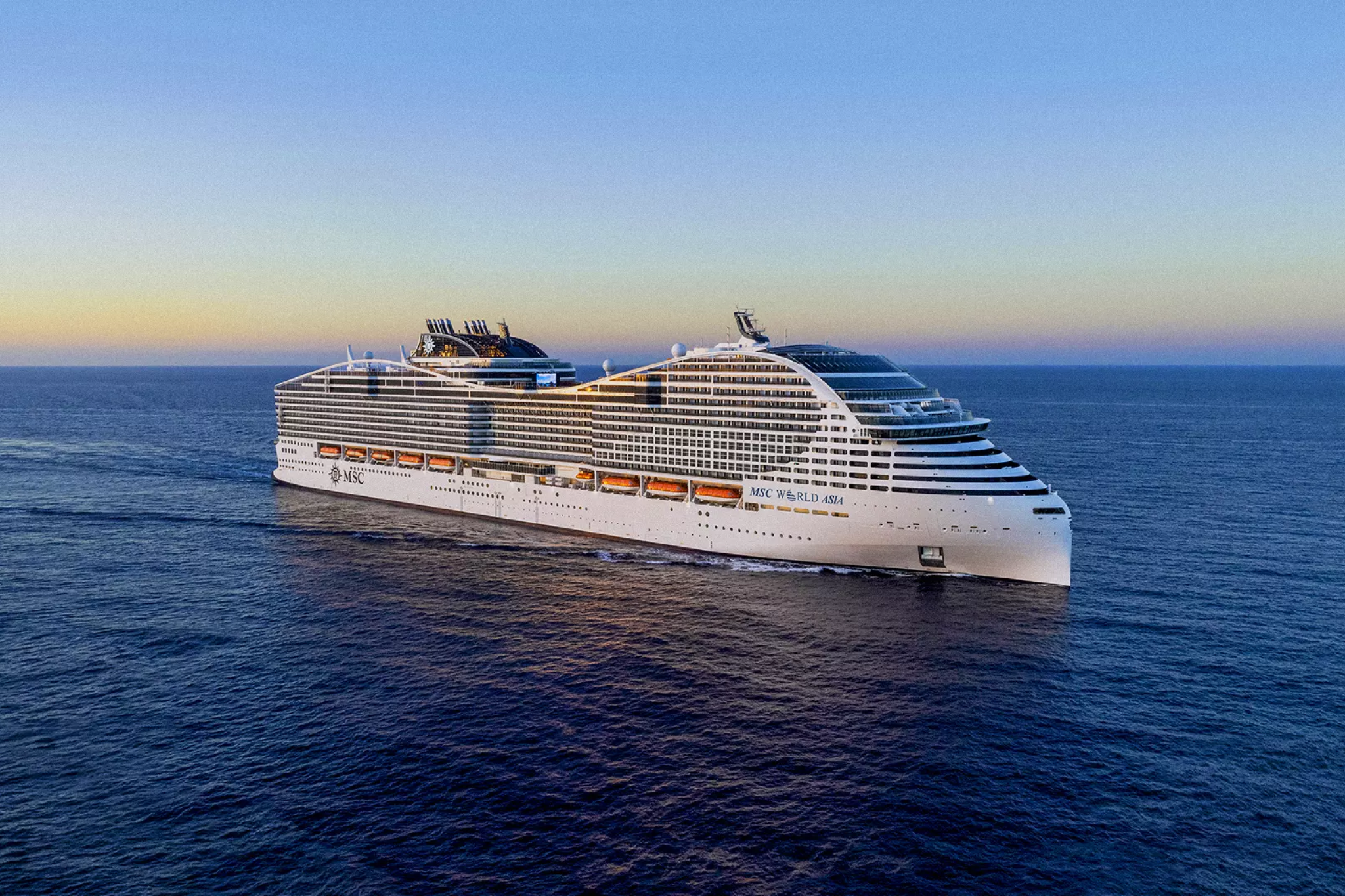 MSC World Asia cruise ship exterior at sea showcasing World Class design, expansive scale, and modern Mediterranean styling
