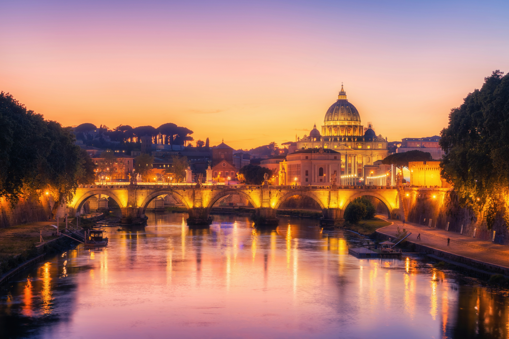 Sunset view of Rome along the Tiber River, a featured destination on MSC World Asia’s Western Mediterranean itineraries