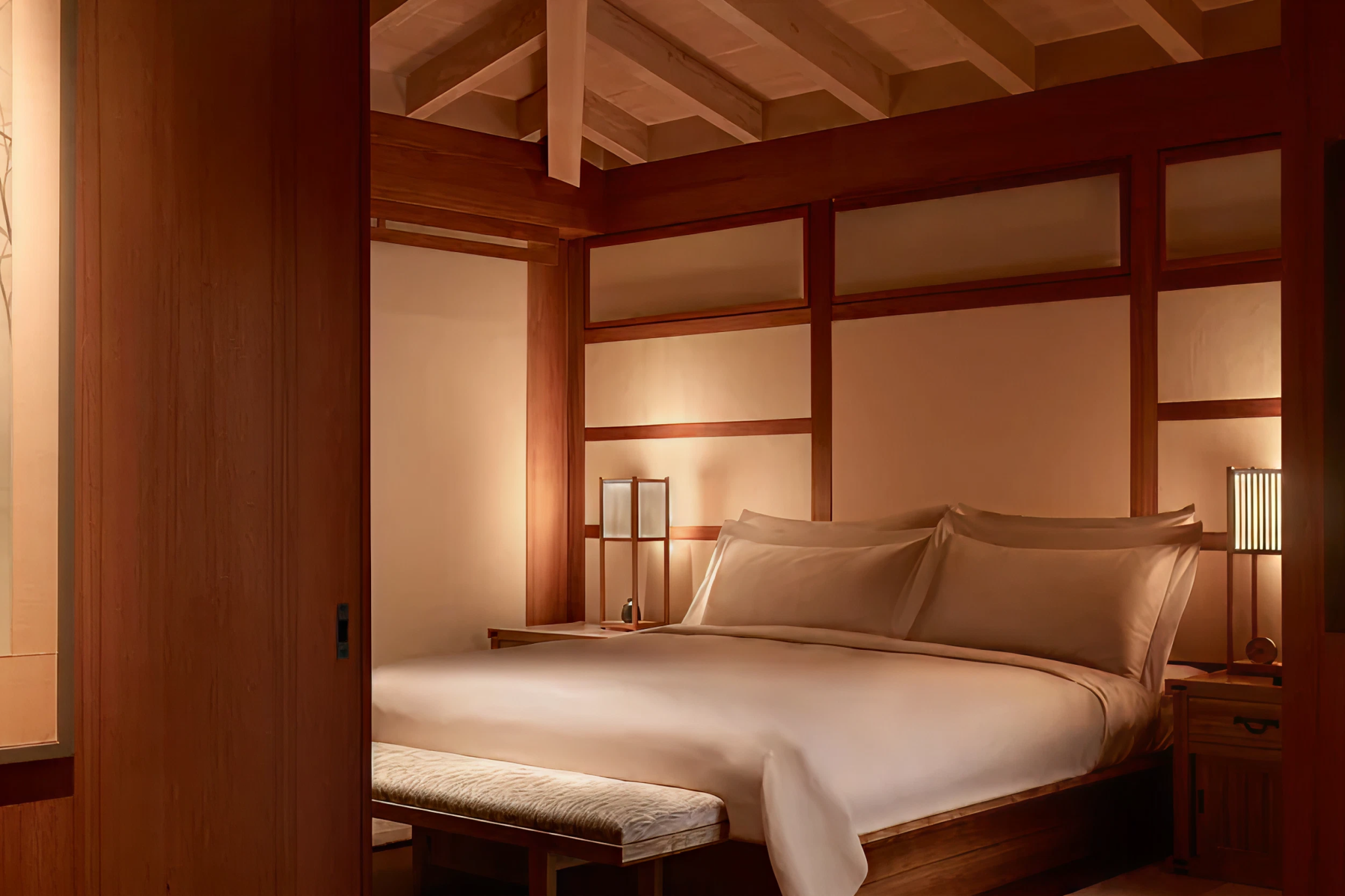 Bedroom at Nobu Ryokan Malibu with minimalist Japanese-style interiors and warm lighting