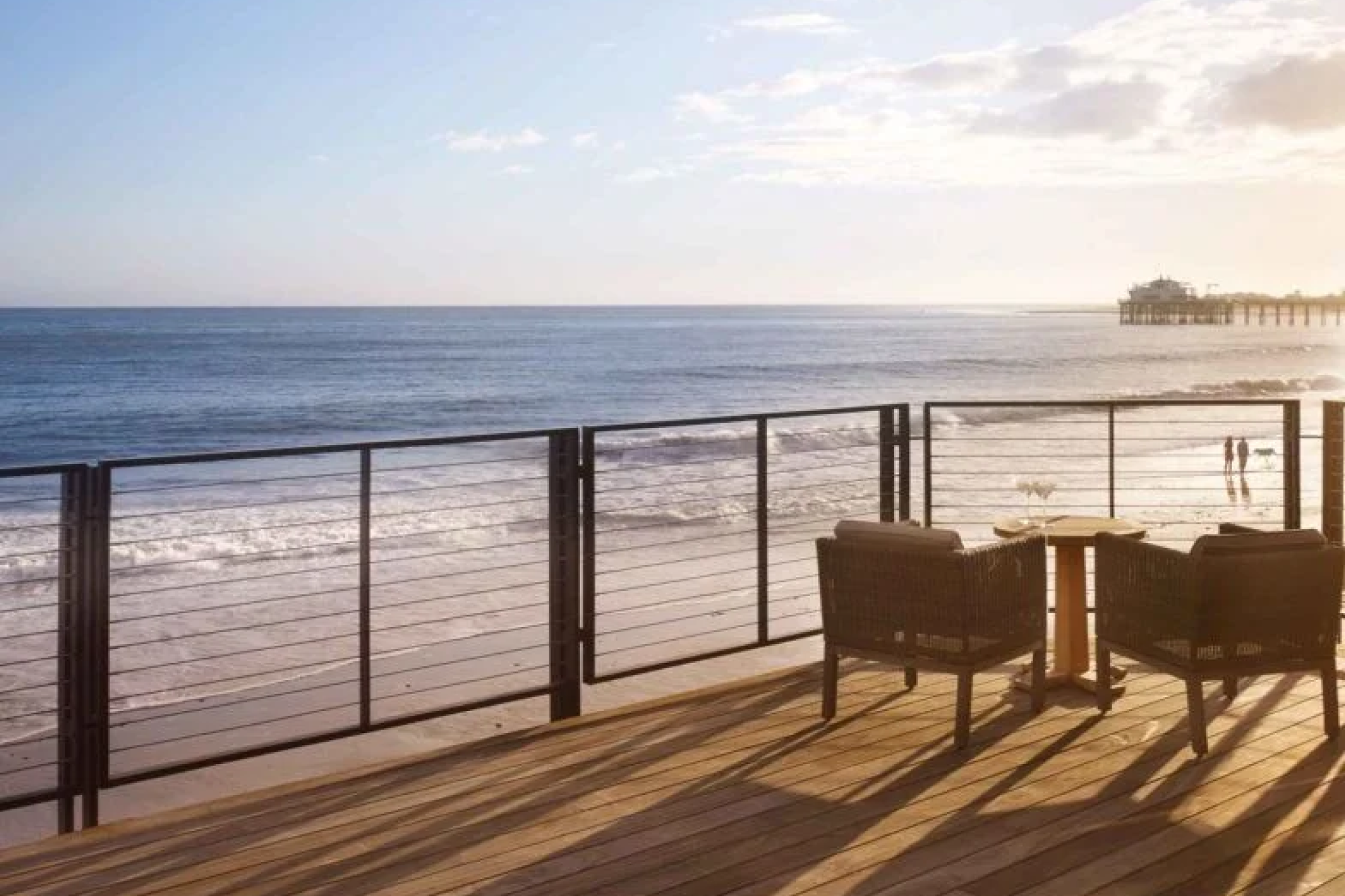 Oceanfront deck at Nobu Ryokan Malibu with seating overlooking Carbon Beach and Malibu Pier