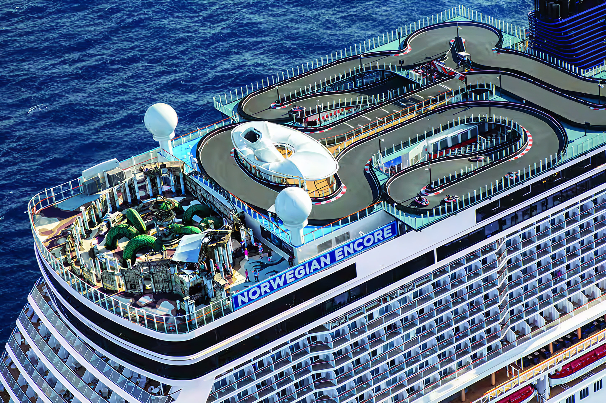 Aerial view of Norwegian Encore’s top-deck go-kart race track, one of the ship’s signature attractions at sea.