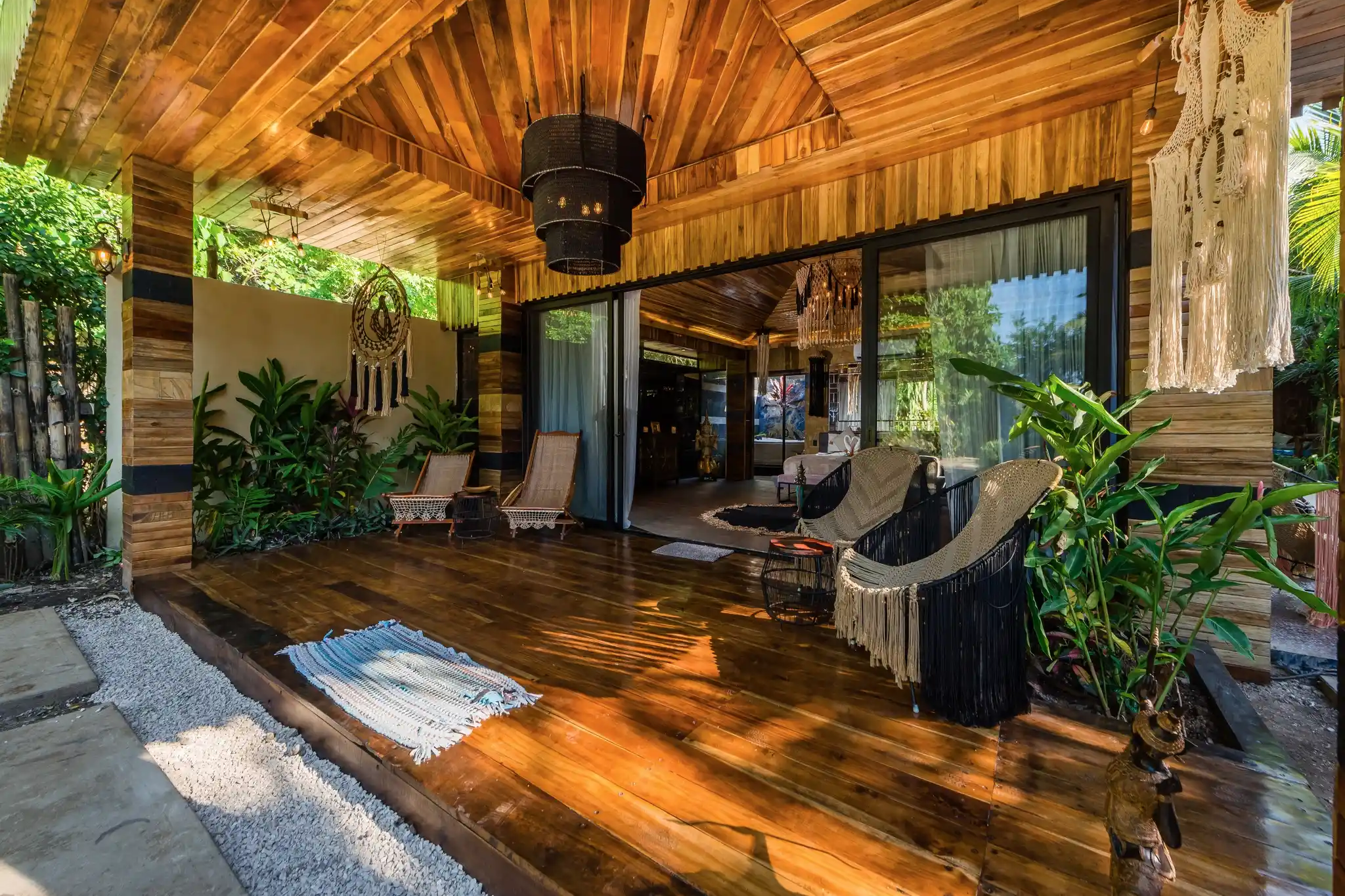 Garden pathway at Ocho Artisan Bungalows leading to rustic, handcrafted villas surrounded by tropical greenery.
