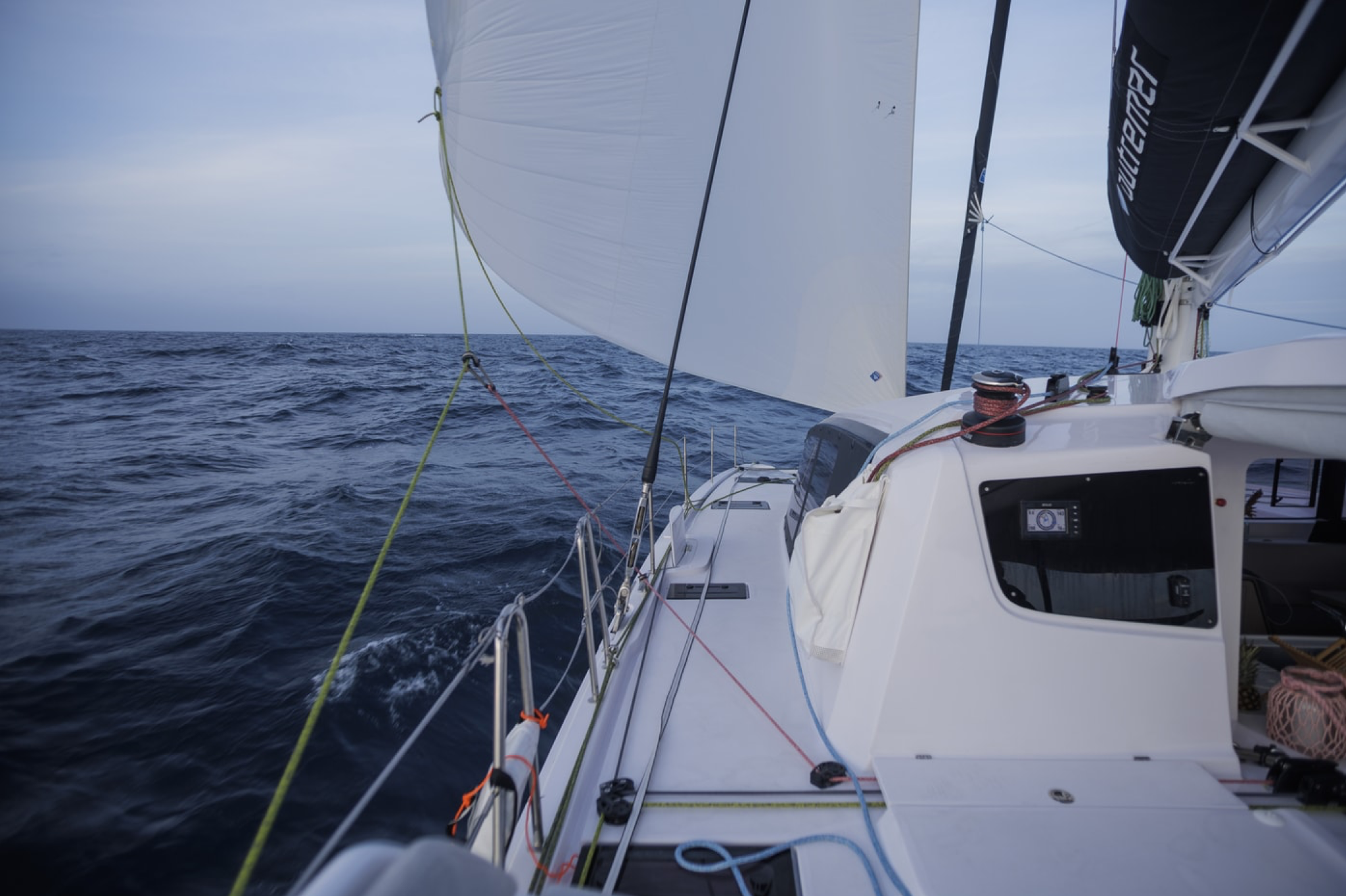 Deck view of the Outremer 52 showing sail trim and rigging while underway.