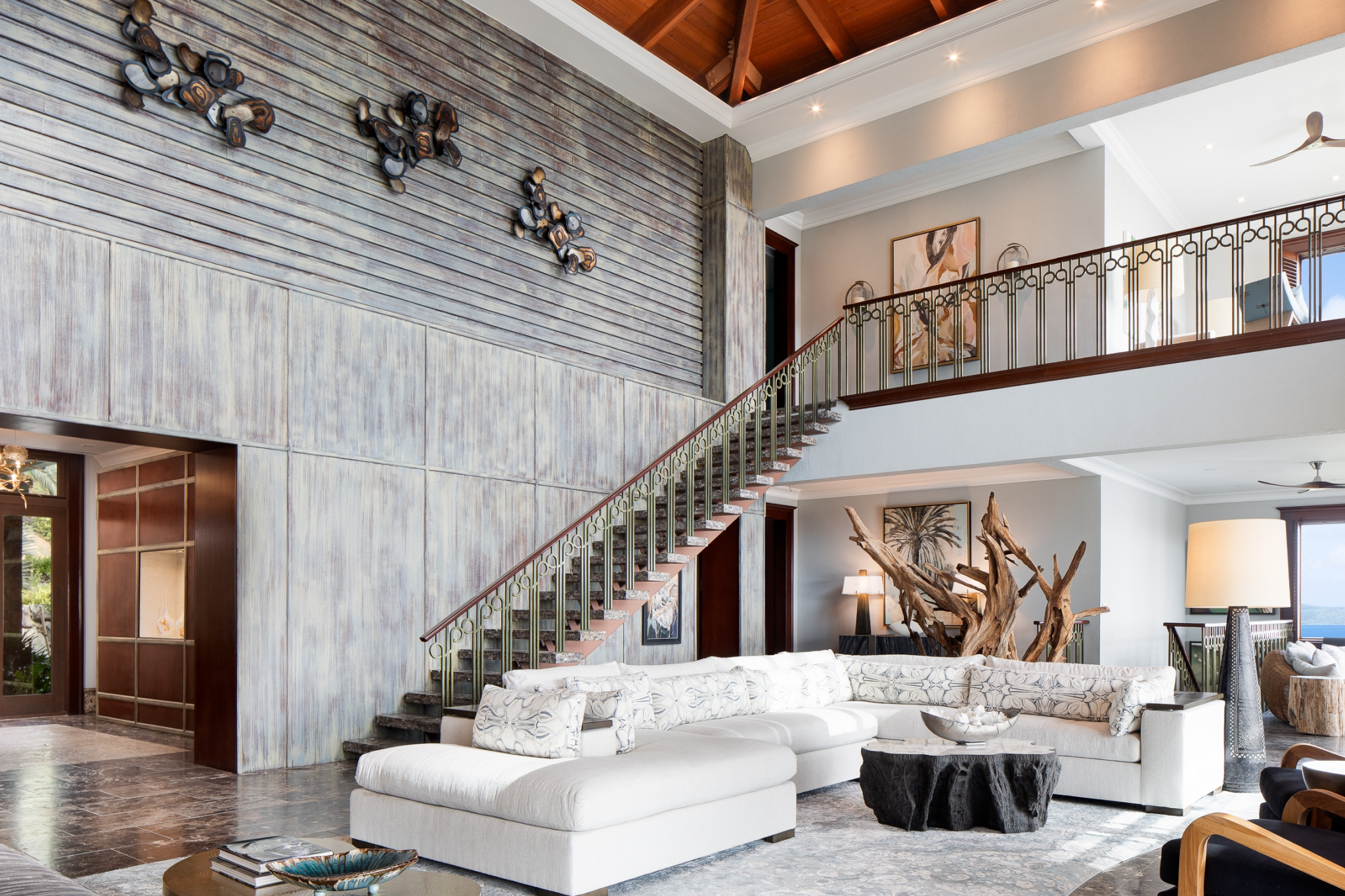 Elegant villa interior at Peter Island Resort featuring open living space, ocean views, and natural Caribbean-inspired design.