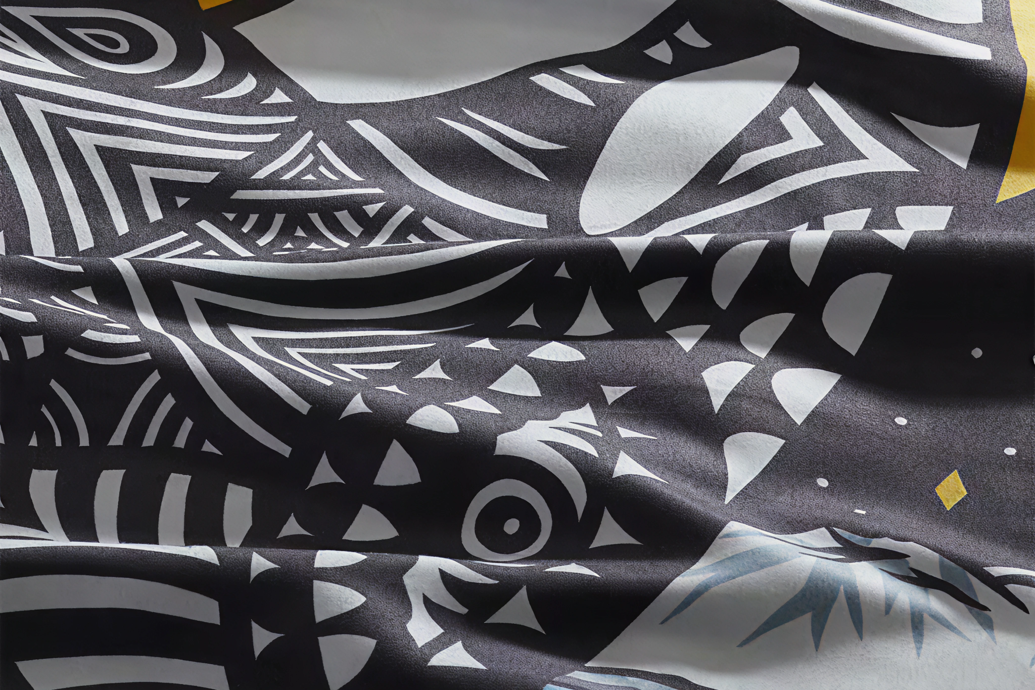 Close-up of a patterned PackTowl Personal microfiber fabric, showing texture and absorbency that make it one of the Best Quick-Dry Towels for the Beach.