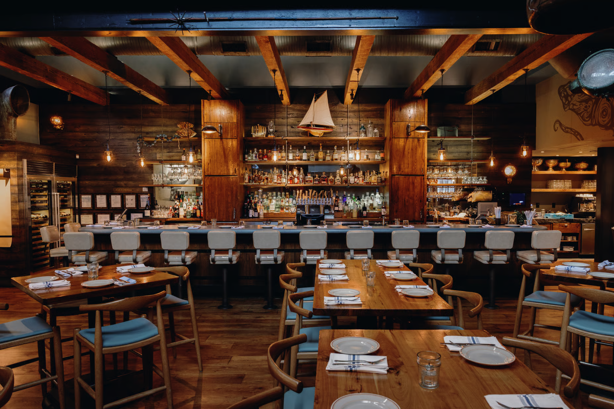 Coastal-inspired interior and seafood spread at Lure restaurant, a local favorite on the list of best seafood restaurants in Atlanta, Georgia.