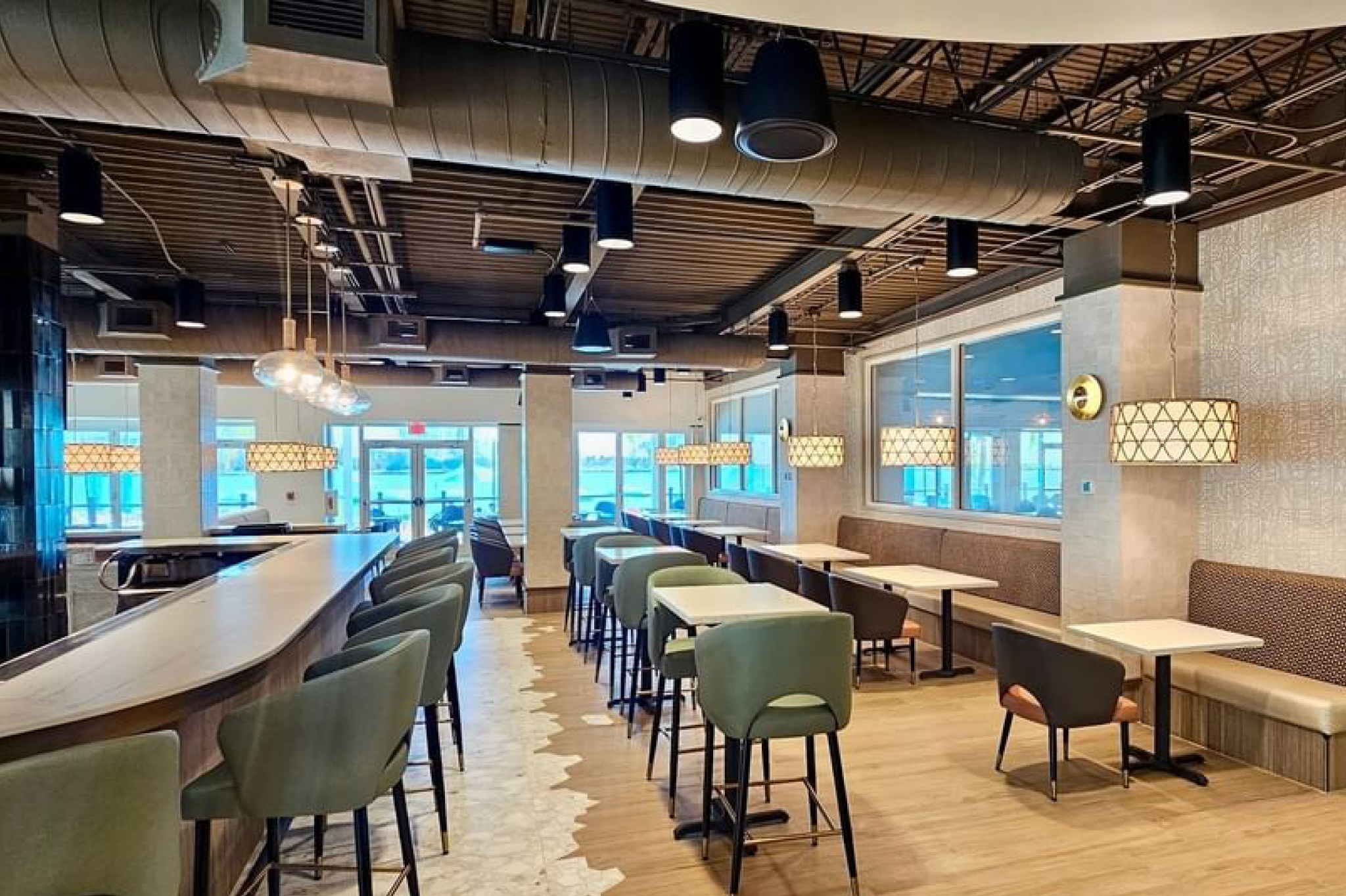 Contemporary indoor dining area with stylish lighting and modern seating at Shephard’s Beach Resort Clearwater’s on-site restaurant.