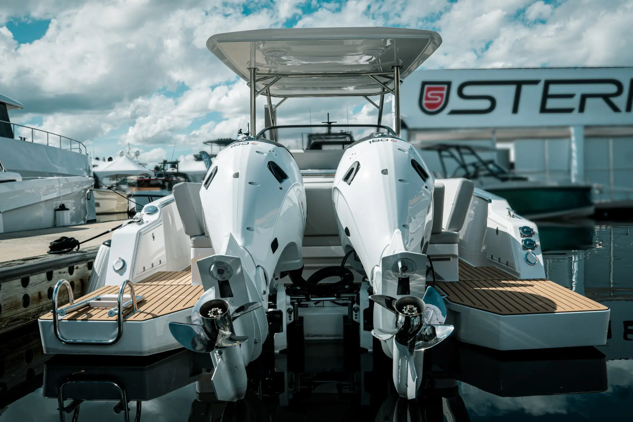 A rear view of the Sterk31 EMOTION showing twin electric outboards, swim platforms, and overall dimensions that define its power, stability, and premium build.