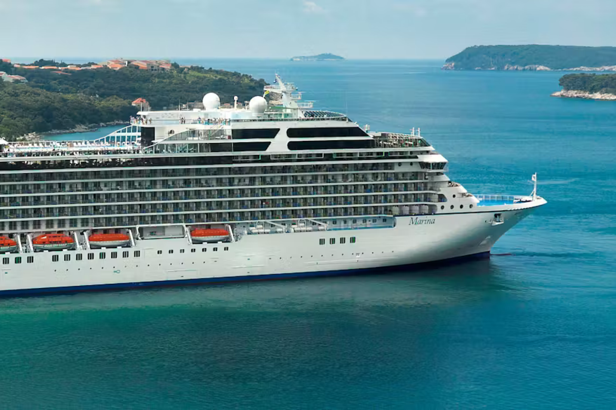 Oceania’s Marina navigating coastal waters—part of the best cruises for seniors who value gourmet dining and immersive destinations.