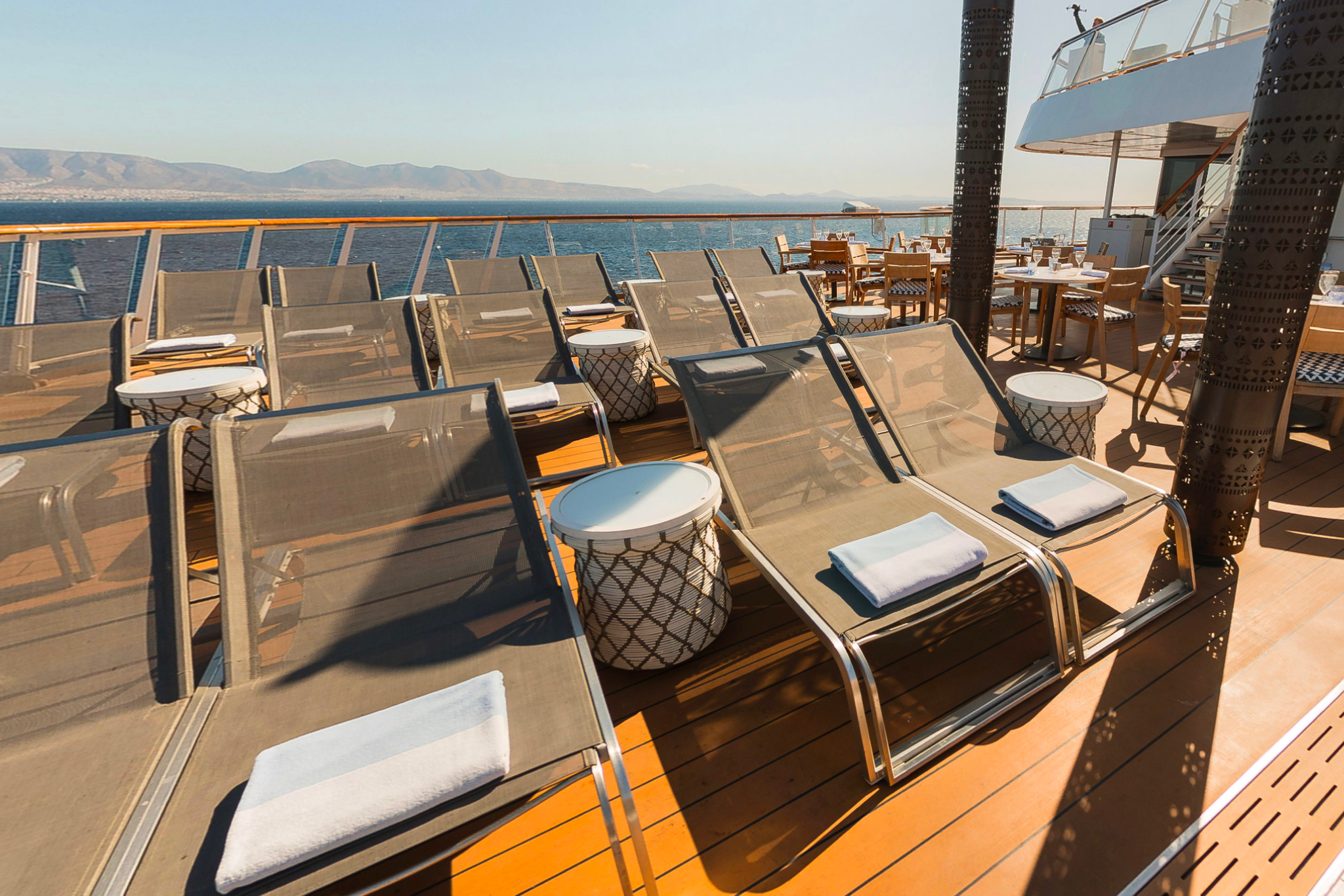 Outdoor deck on Viking Libra featuring quiet relaxation areas, Scandinavian design details, and panoramic sea views