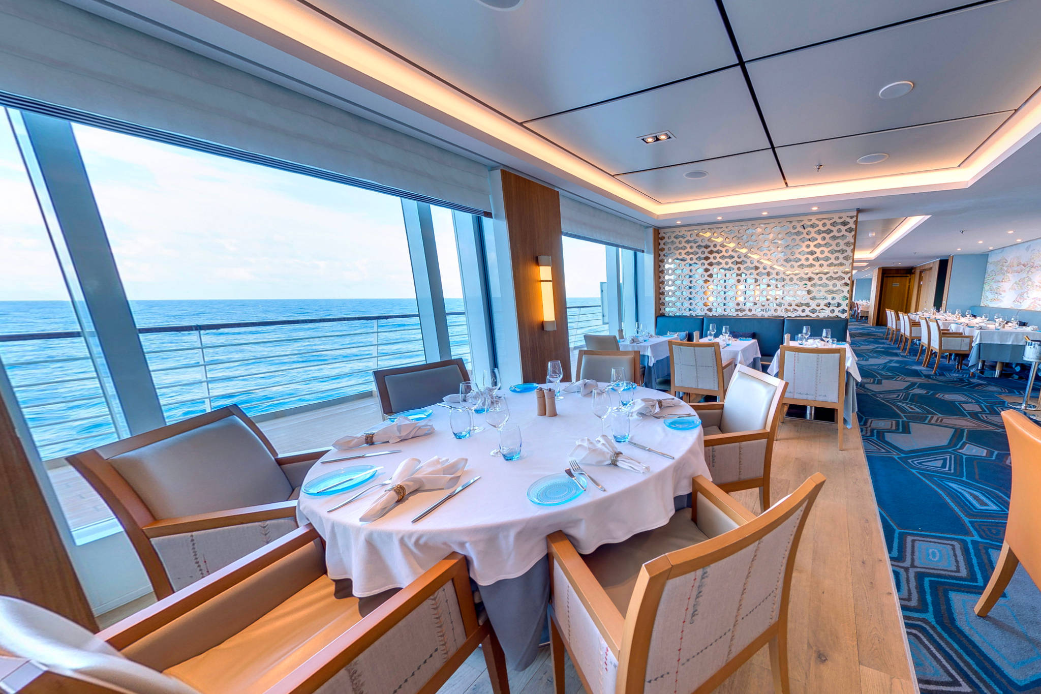 Viking Libra veranda stateroom with private balcony, minimalist Scandinavian interior, and floor-to-ceiling ocean views