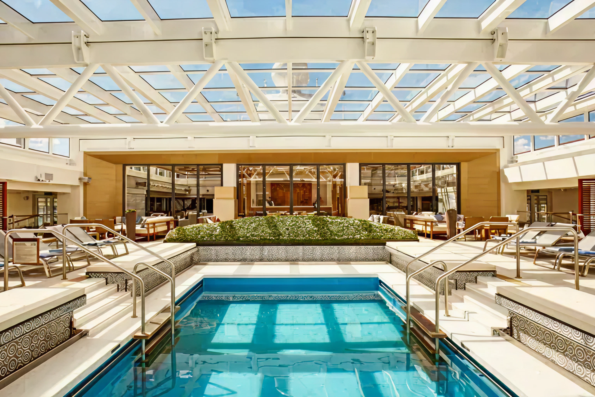 Indoor pool and relaxation area onboard Viking Mira featuring Scandinavian design, natural light, and serene spa-like atmosphere