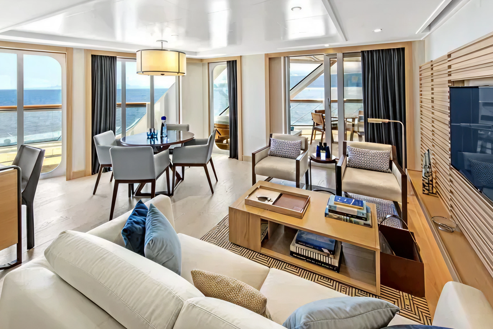 Viking Mira veranda stateroom living area with private balcony, ocean views, and refined Scandinavian interior design