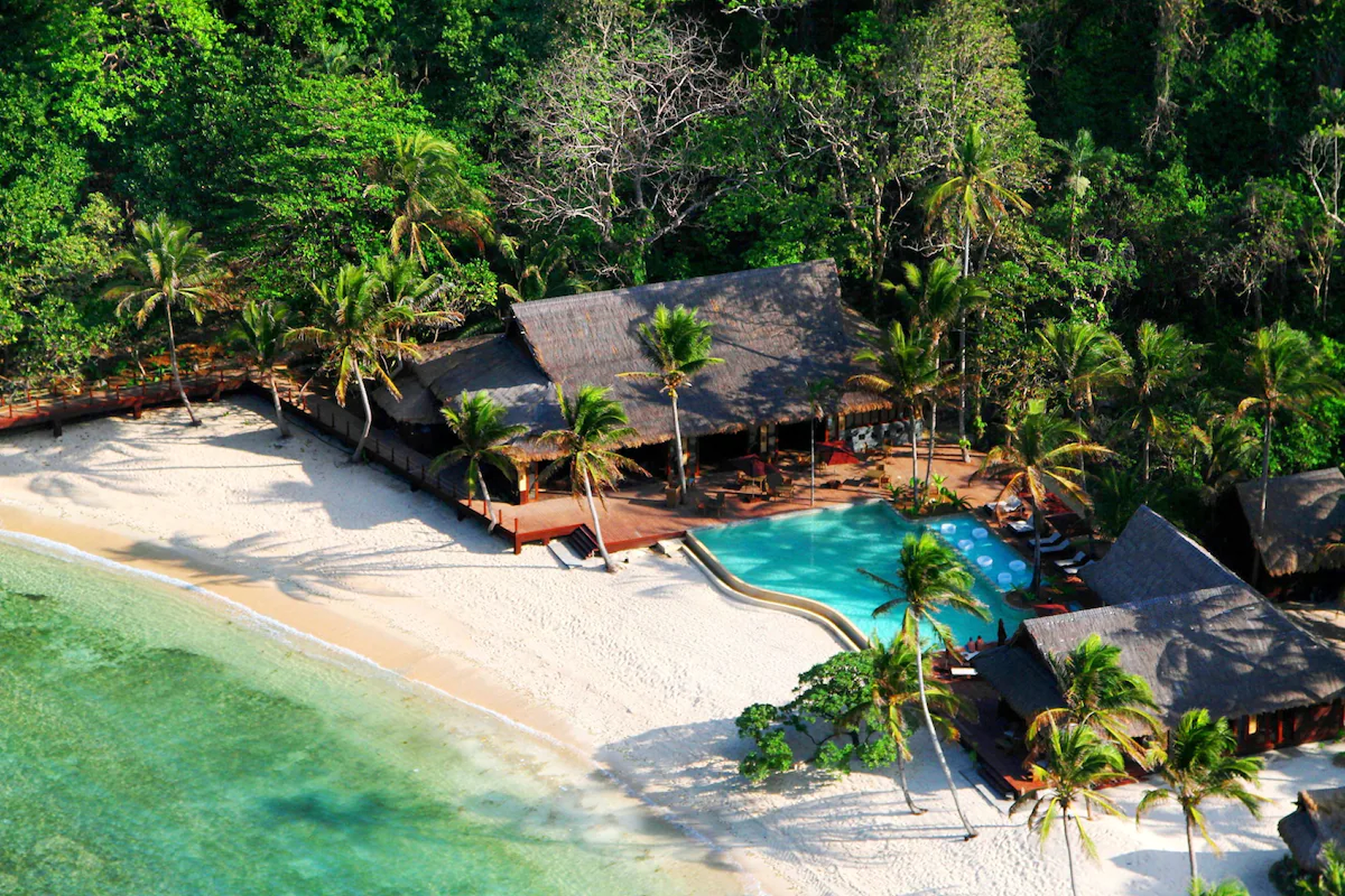 Tropical island resort with overwater villas and infinity pool — where to stay in El Nido, Palawan.