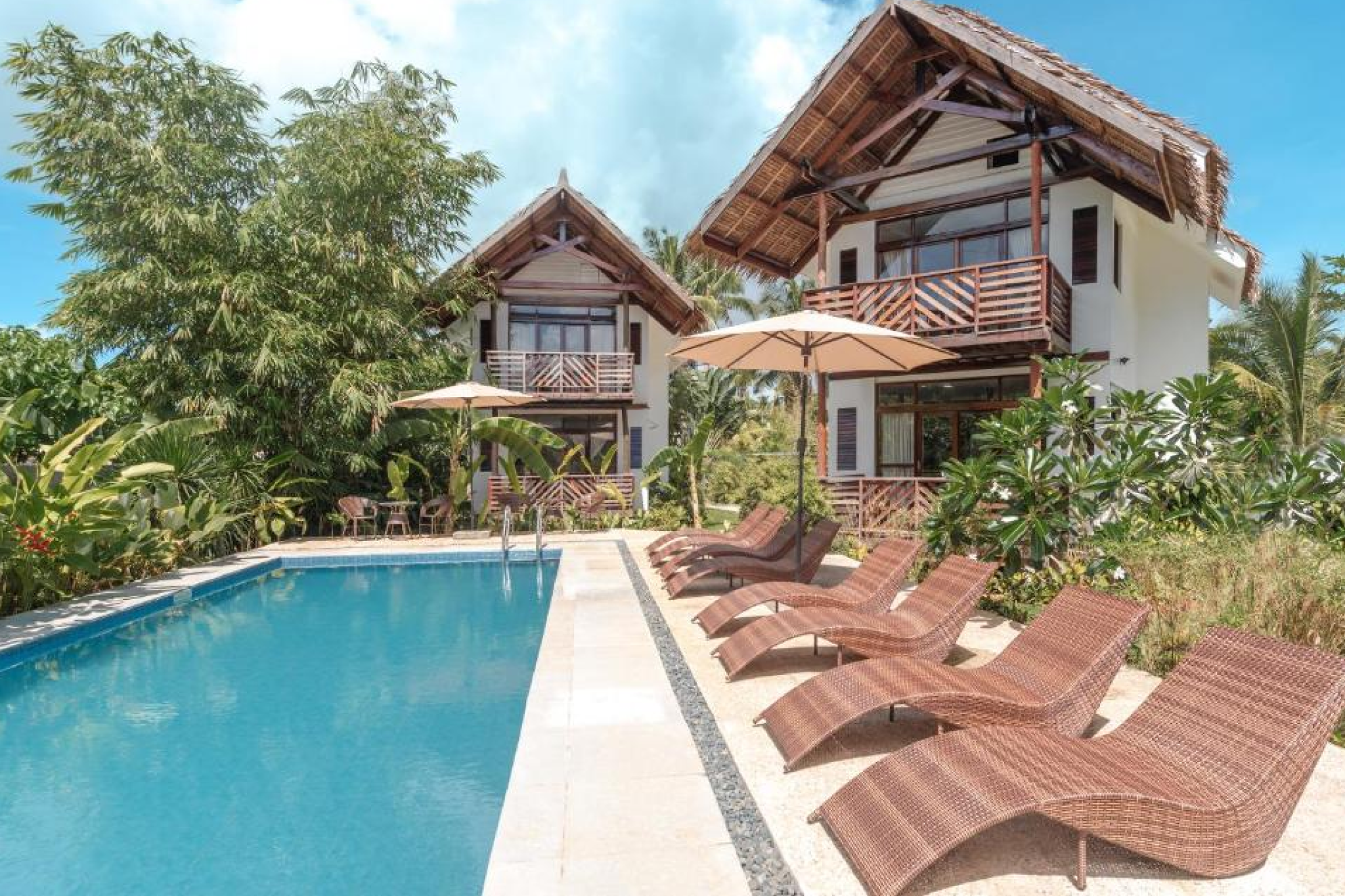 Tropical villas with pool and sun loungers — Bulan Villas Siargao, Where to Stay in Siargao.