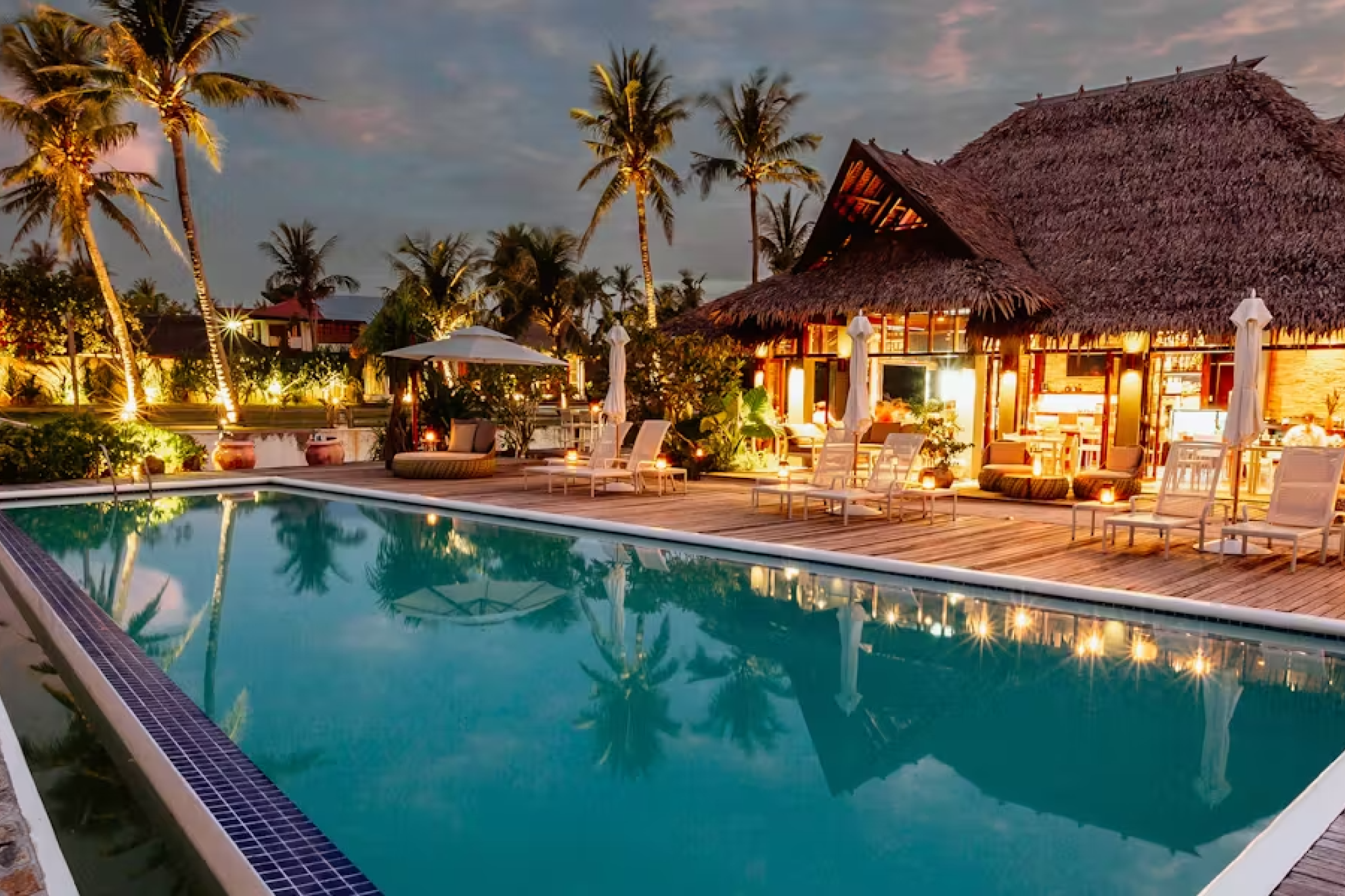 Poolside dining and sunset ambiance — Isla Cabana Resort, Where to Stay in Siargao.